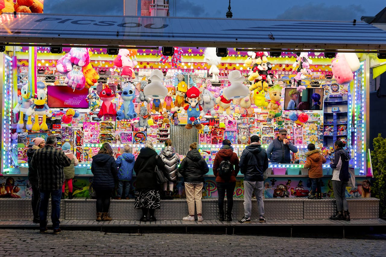 Guests at a funfair game stall