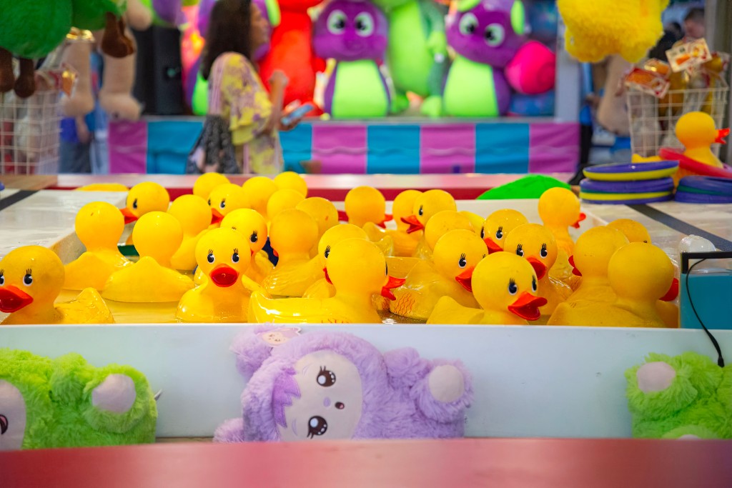 Yellow rubber ducks at a hook-a-duck game stall